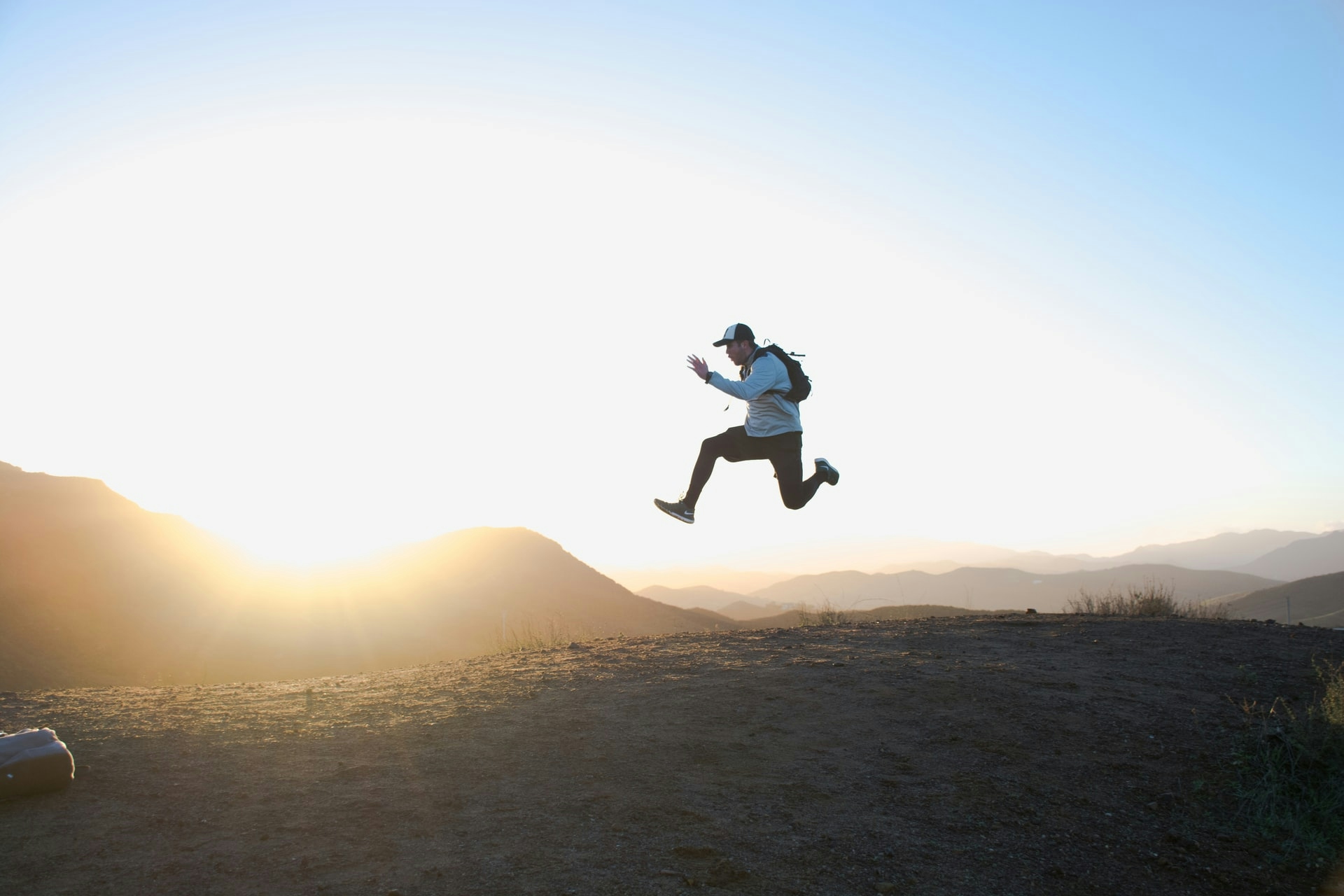 A man doing a running jump in the air